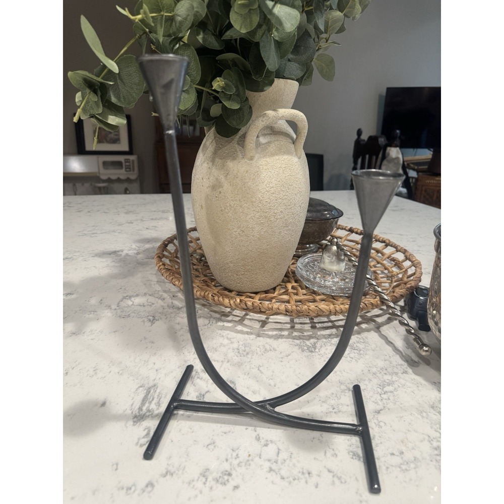 two-arm metal candelabra with a minimalist, U-shaped design